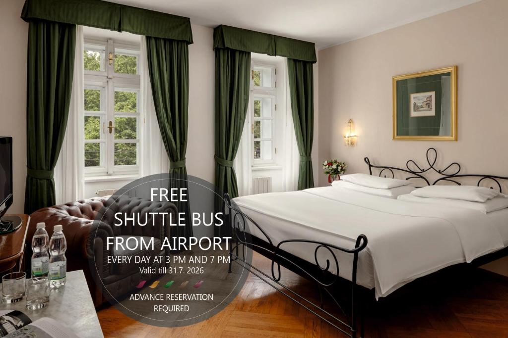 a bedroom with a bed and a sign that reads shuttle bus from airport at Hotel Roma Prague in Prague