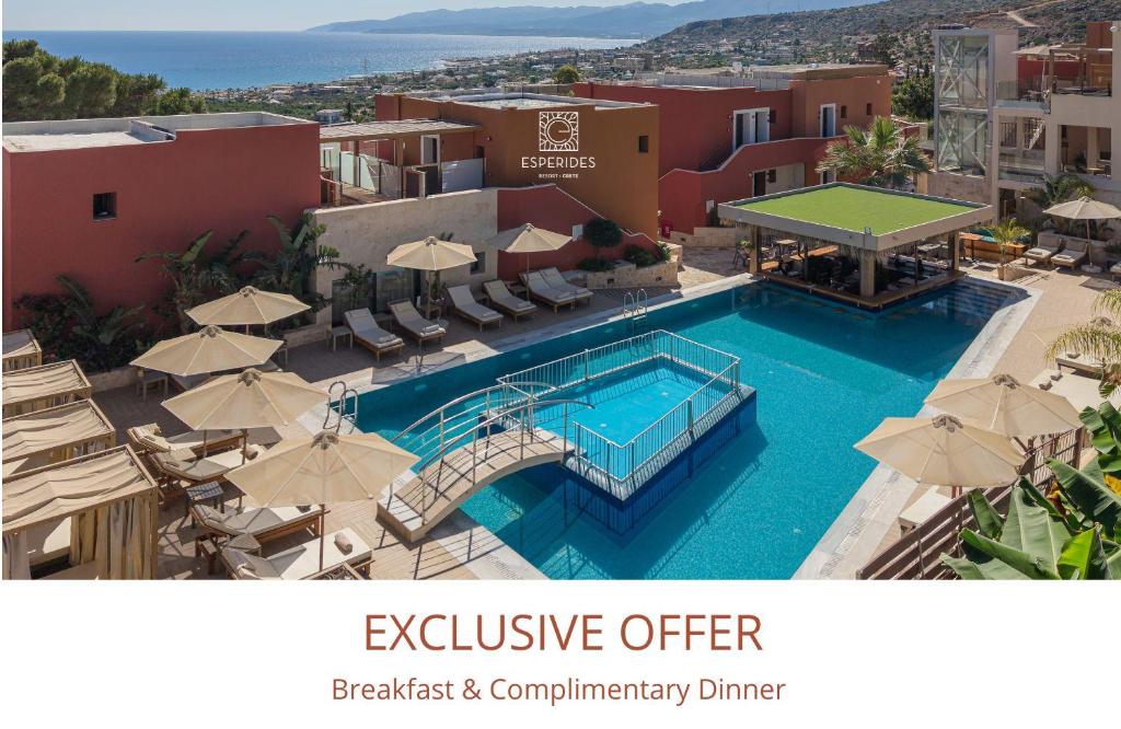 an image of an outdoor swimming pool with umbrellas at Esperides Resort Crete, The Authentic Experience in Hersonissos