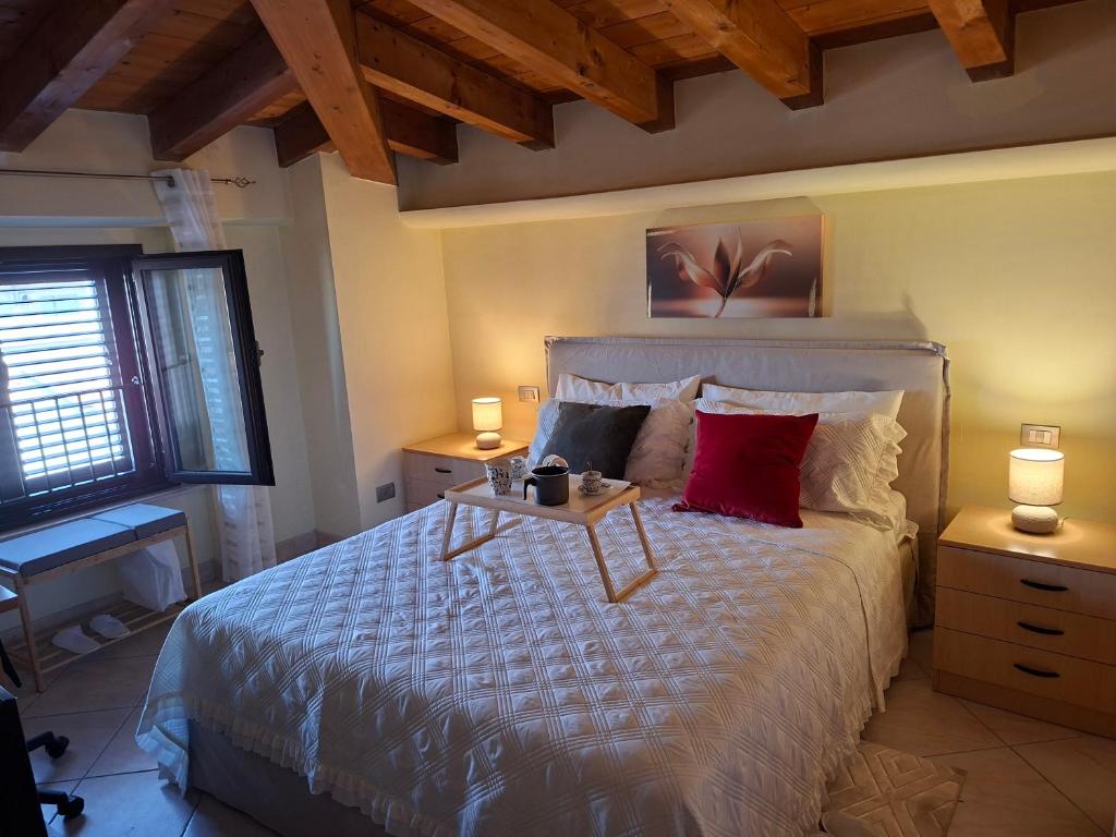 a bedroom with a large bed with a table on it at LOCAZIONE TURISTICA Camere De Vito in San Salvo