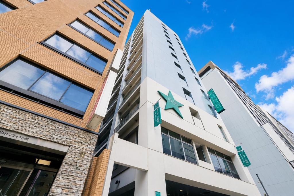a building with a star on it at Urbain Hiroshima Central in Hiroshima