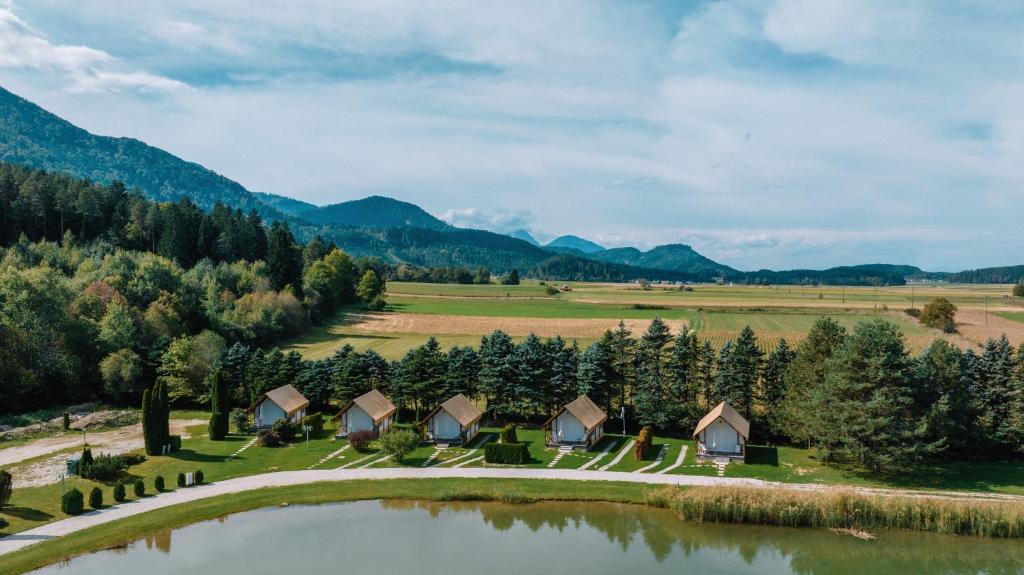 an aerial view of a resort with a lake and mountains at Sunrise Lake Area in Unterlibitsch