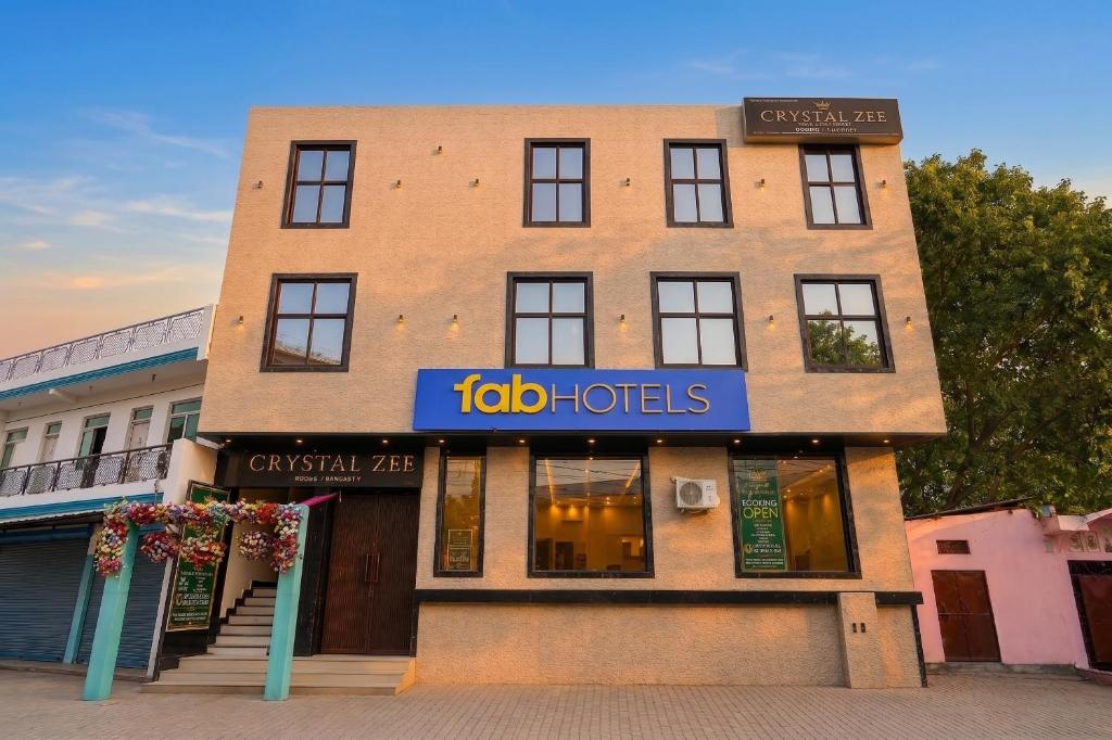 a building with a sign that reads idol hotels at FabHotel Crystal Zee in Kānpur
