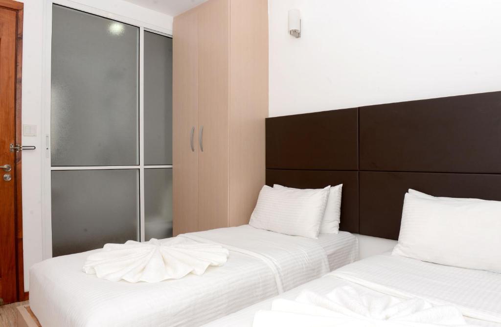 Postel nebo postele na pokoji v ubytování Express Inn at Hulhumale