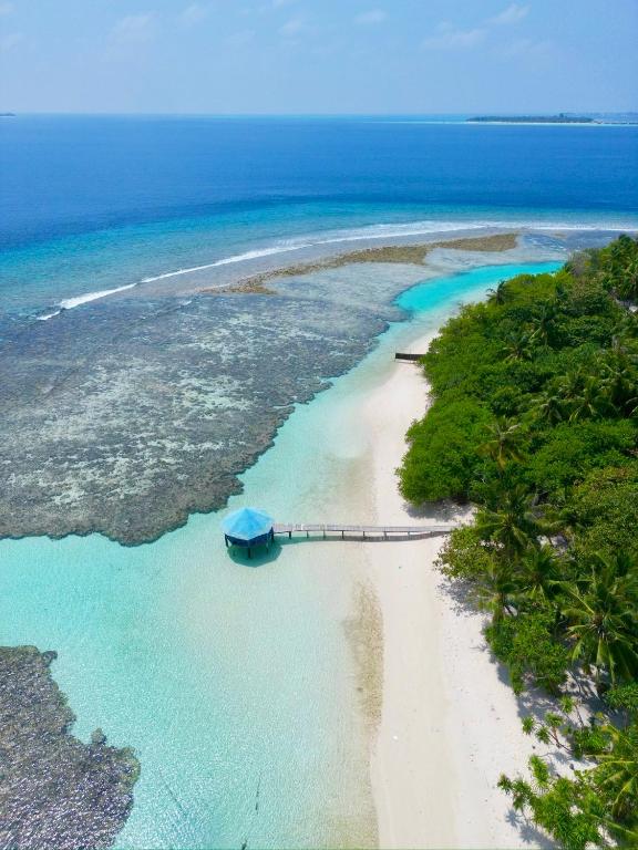 an aerial view of a beach with a pier at Amaria Maldives in Finolhus