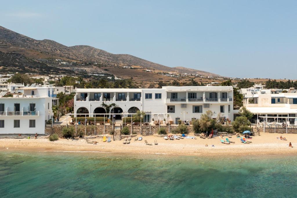 a view of a beach with white buildings at Blue Waves Suites & Apartments - To Kyma in Drios