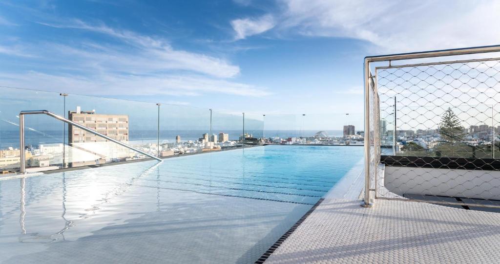 a swimming pool on the roof of a building at Barceló Santa Cruz Contemporáneo in Santa Cruz de Tenerife