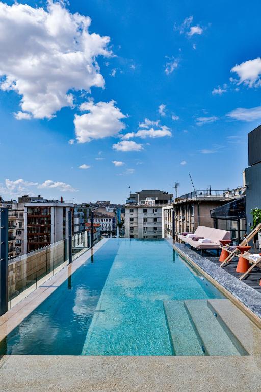 a swimming pool on the roof of a building at VISION Omonia Athens in Athens