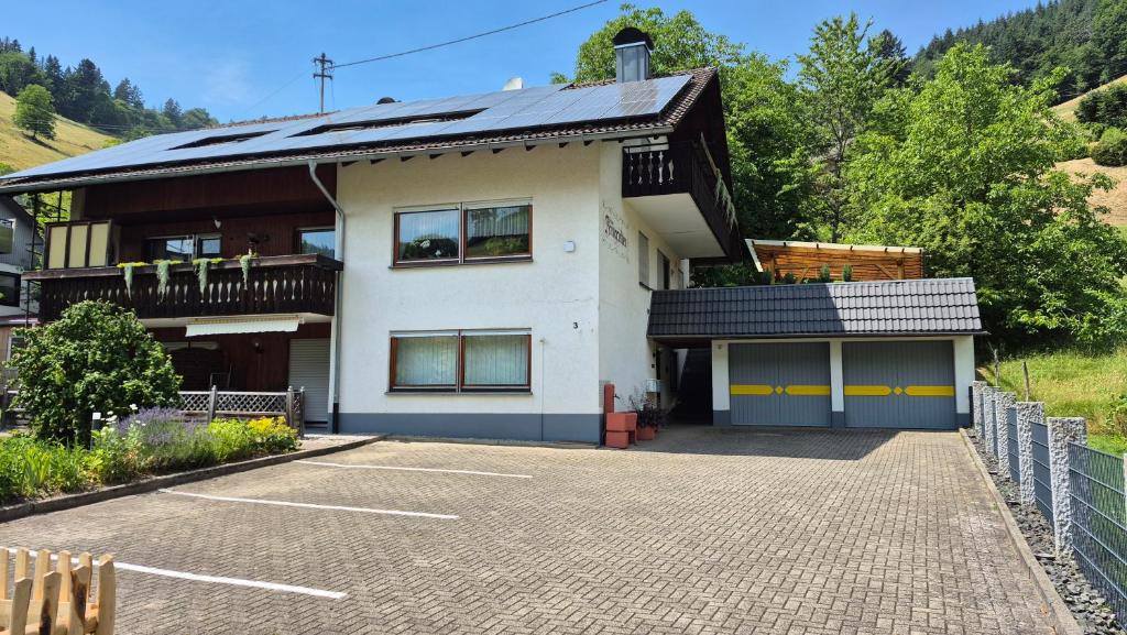 a house with a parking lot in front of it at Haus Brengartner in Münstertal