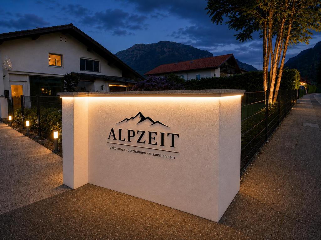 a sign that says alappert with a mountain on it at Alpzeit Ferienwohnung in Bayerisch Gmain
