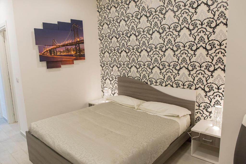 Posteľ alebo postele v izbe v ubytovaní Metronia Guest House