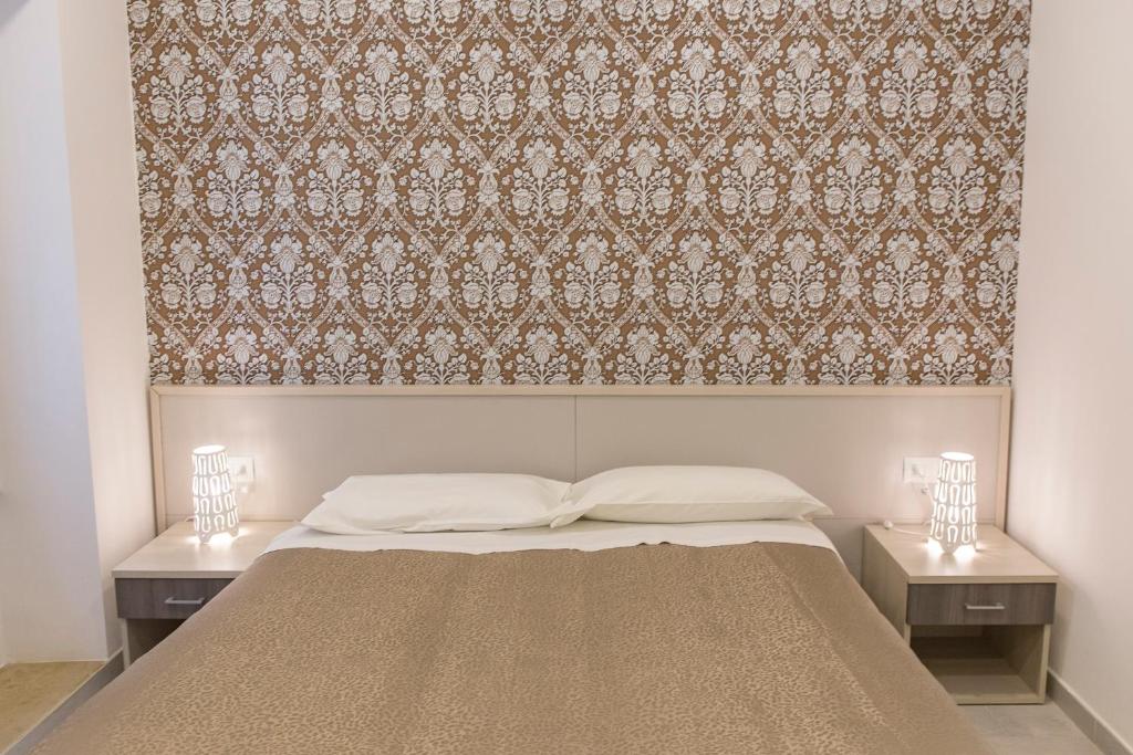 Posteľ alebo postele v izbe v ubytovaní Metronia Guest House