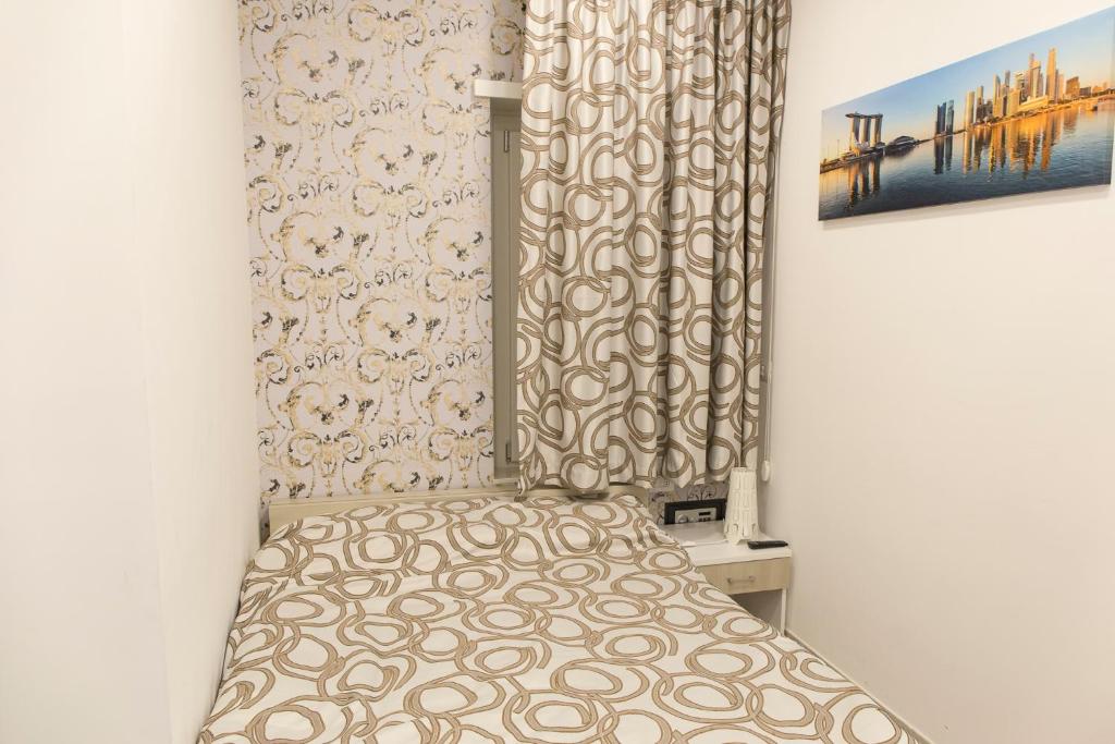 Posteľ alebo postele v izbe v ubytovaní Metronia Guest House