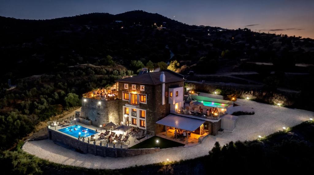 an aerial view of a mansion at night at Saronic Citadel Luxury Villa-Private Estate on Salamina Island in Salamina