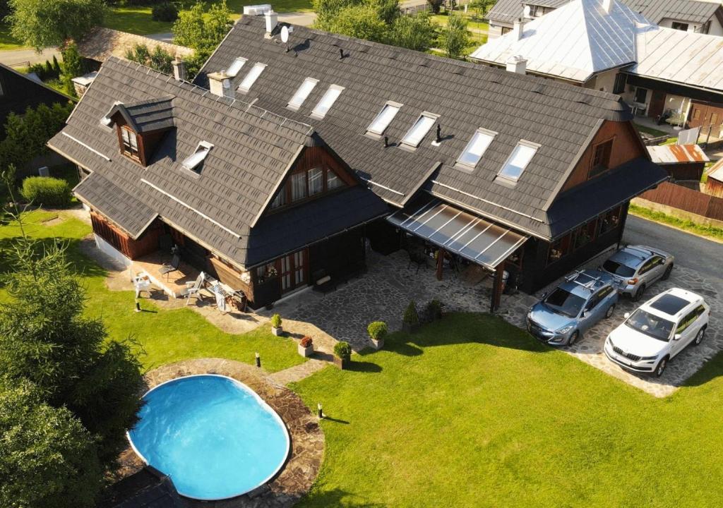 an aerial view of a large house with a pool at Rusínsky Dvor s privátnym Wellness in Malý Lipník