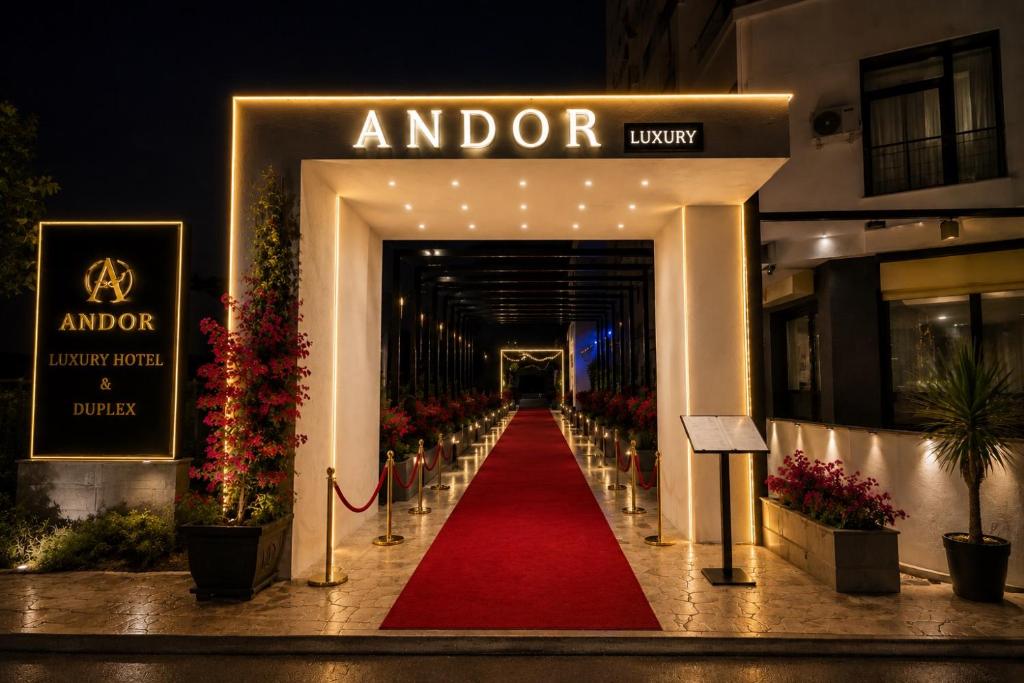 a red carpeted walkway leading into a hotel at Andor Luxury Hotel & Duplex in Durrës
