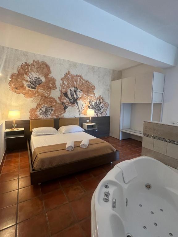 a bedroom with a bed and a bath tub at Agriturismo Tenuta de Castro in Aprilia