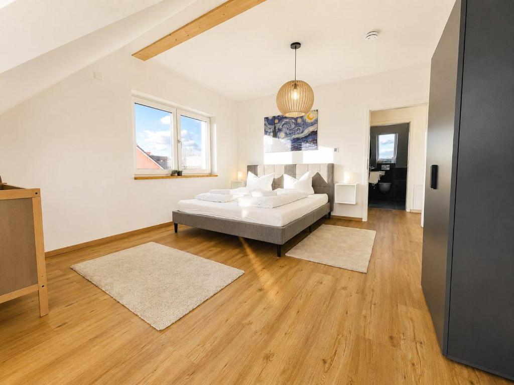 a living room with a bed and a couch at Dill Apartment Pleinfeld am Brombachsee III in Pleinfeld