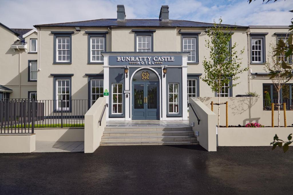 a building with the front entrance to a university clinic at Bunratty Castle Hotel & Leisure Club, BW Premier Collection in Bunratty