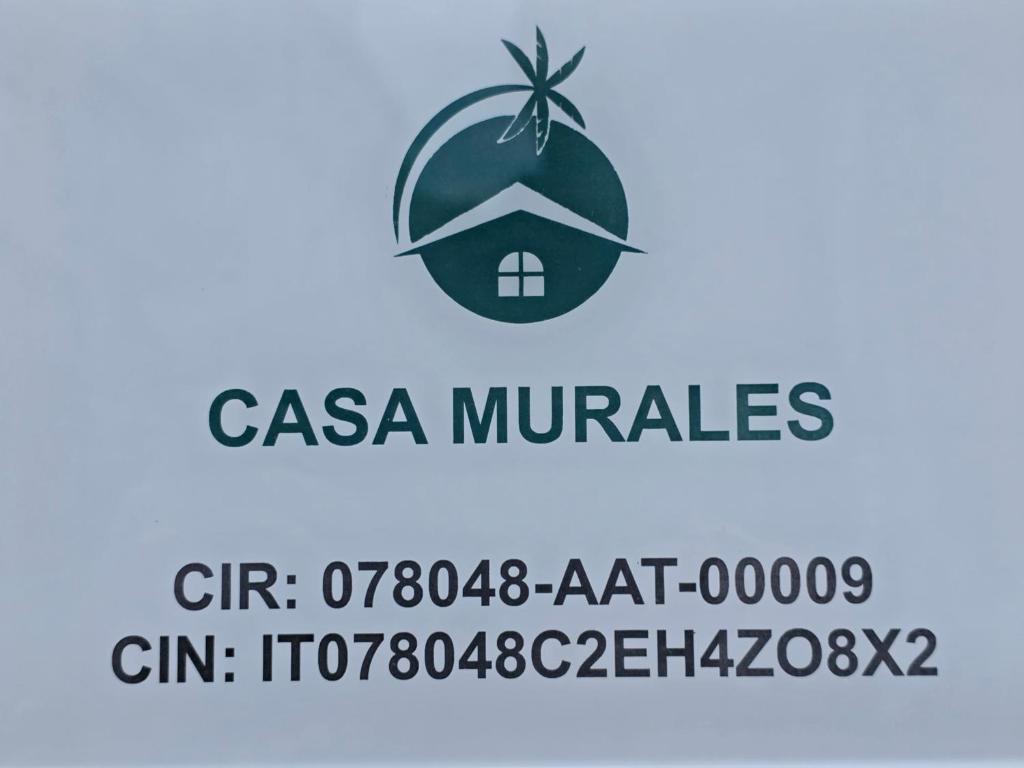 a sign for the casa miracles logo at Casa Murales in Diamante