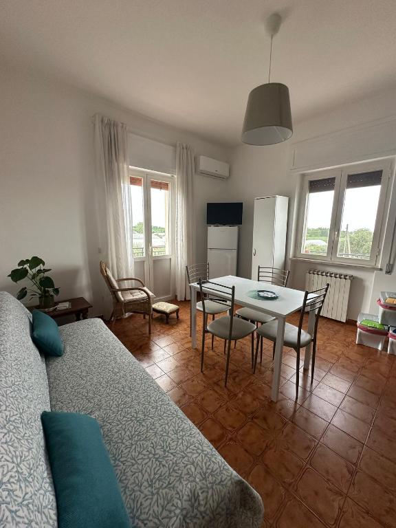 a living room with a table and a dining room at Casa Lea - Sperlonga in Sperlonga
