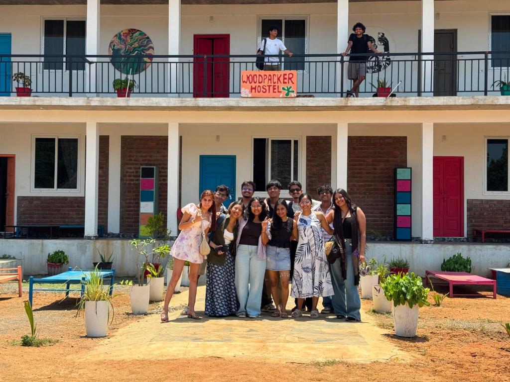 a group of women standing in front of a building at WoodPacker Hostel Auroville Pondicherry in Auroville