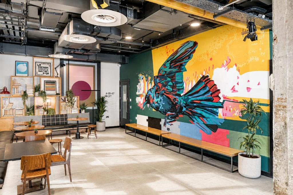 a restaurant with a large butterfly mural on the wall at Latroupe Jacobs Inn in Dublin