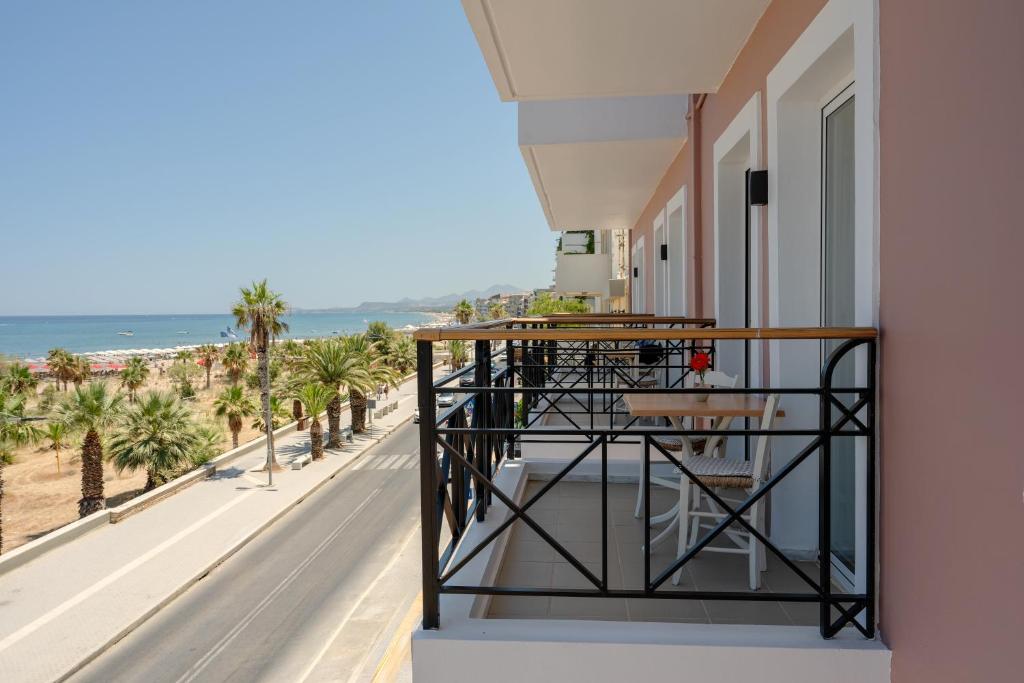 a balcony with a view of the beach at Thalyra in Rethymno