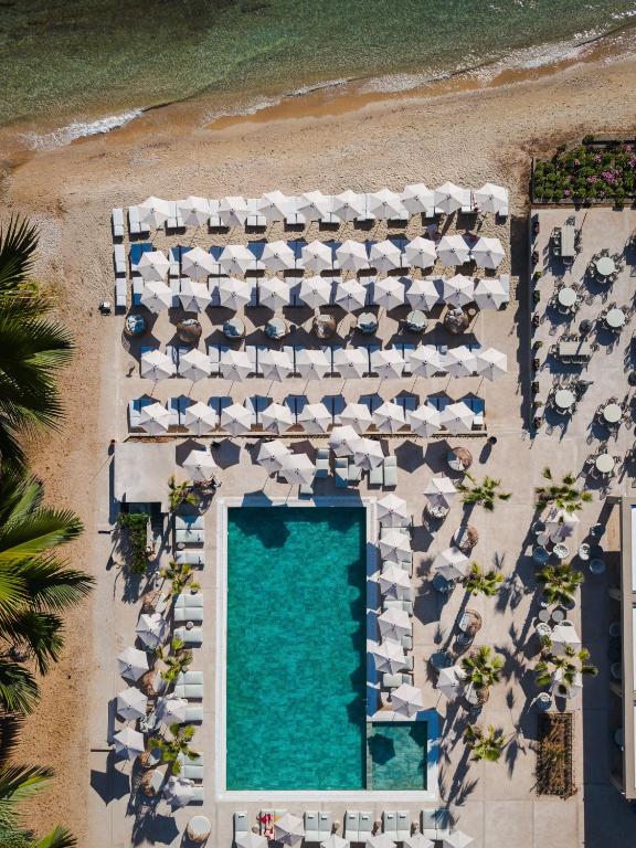 an aerial view of a beach with umbrellas and a swimming pool at Medite Kassandra Resort in Nea Moudania
