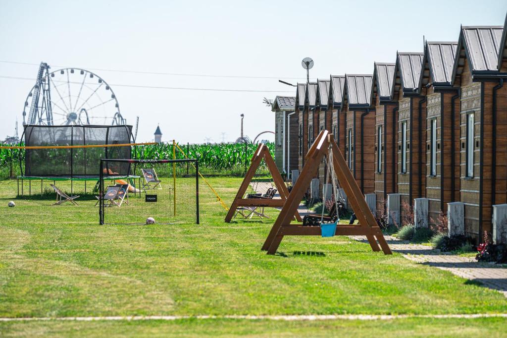 a park with a playground with a ferris wheel at DOMKI#ENERGY Zator in Przeciszów