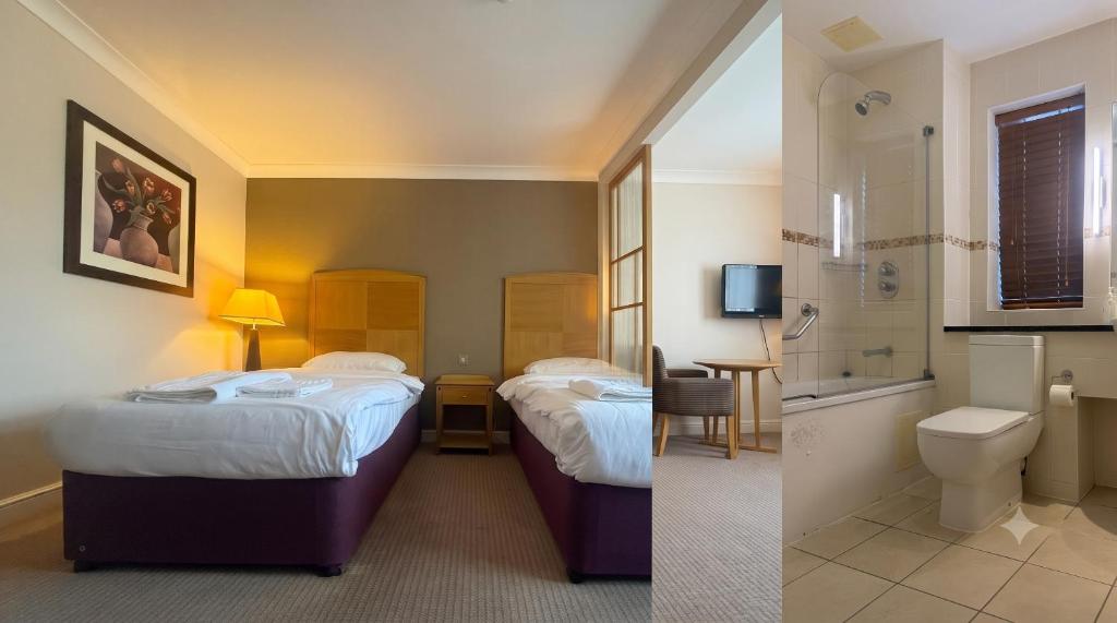 a hotel room with two beds and a bathroom at Blaby Westfield Hotel in Blaby