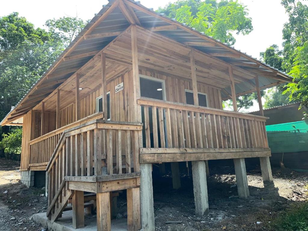 a large wooden house on two logs at Villa Clarice in Bonao
