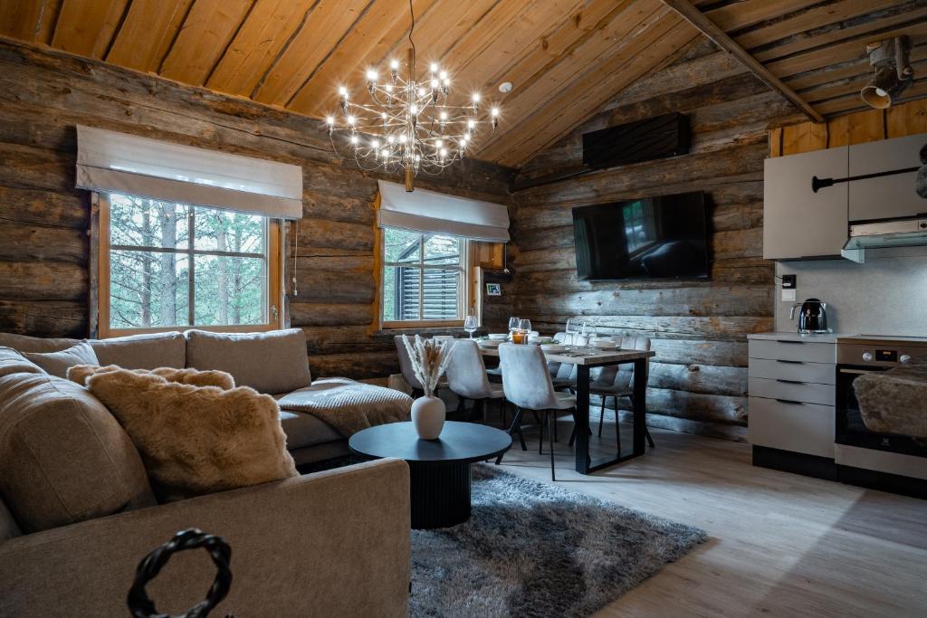 a living room with a couch and a table at Chalet Ruka Aurelius in Ruka