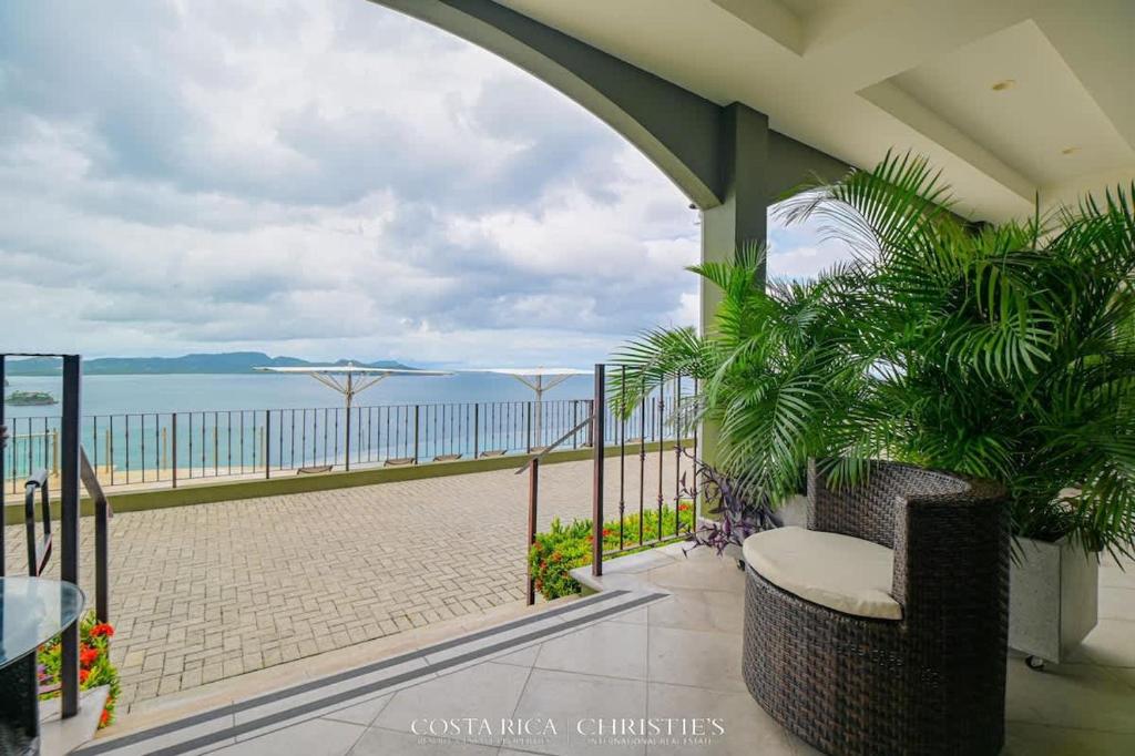 a balcony with a view of the beach at 360 Splendor 306-Ocean View Condo-Breakfast in Playa Flamingo