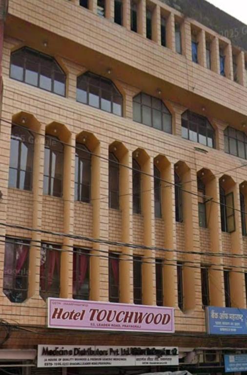 a building with a hotel tokunoko sign in front of it at Hotel Touchwood in Prayagraj