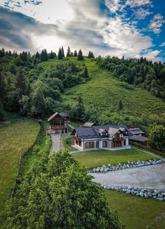 an aerial view of a house on a hill at Fox Chalet in Molidu