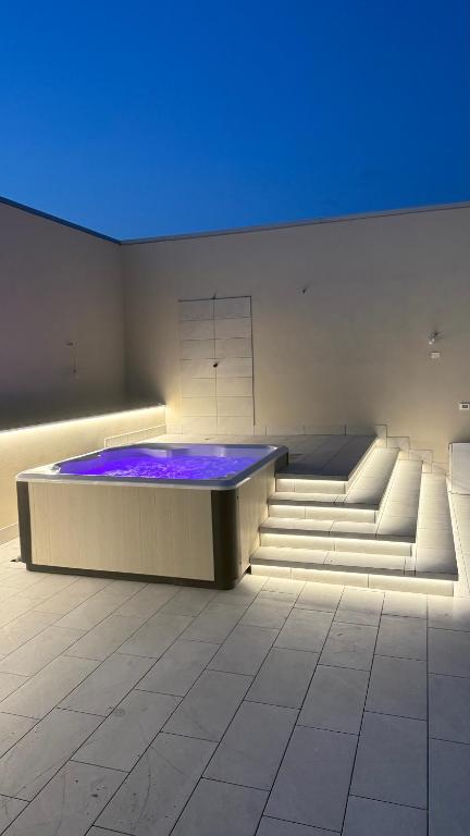 a room with a large tub with purple lights at Villa Miranda RELAX in Ortona