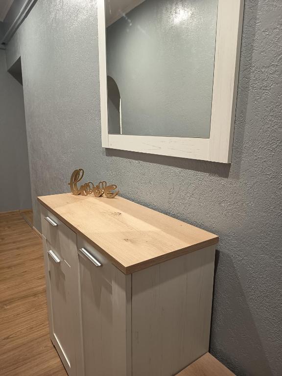 a bathroom with a sink and a mirror at Comfort place in Ternopil