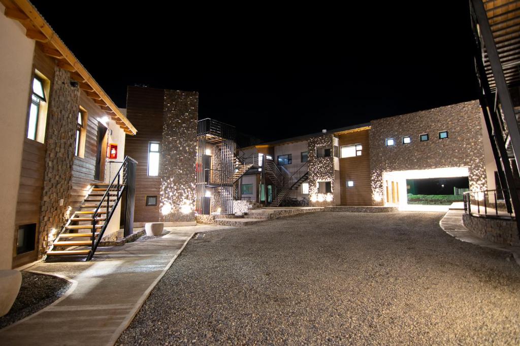 an empty courtyard of a building at night at Panorama Aparts Chalten in El Chalten
