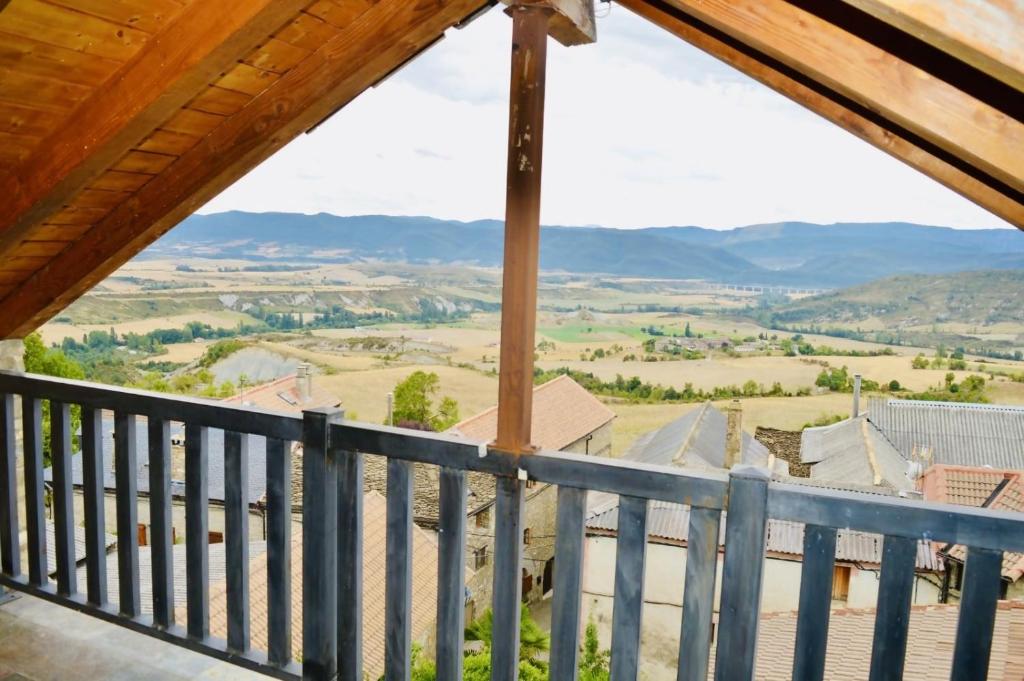 a view from the balcony of a house with mountains in the background at Casa El Mirador de Jaca in Jaca