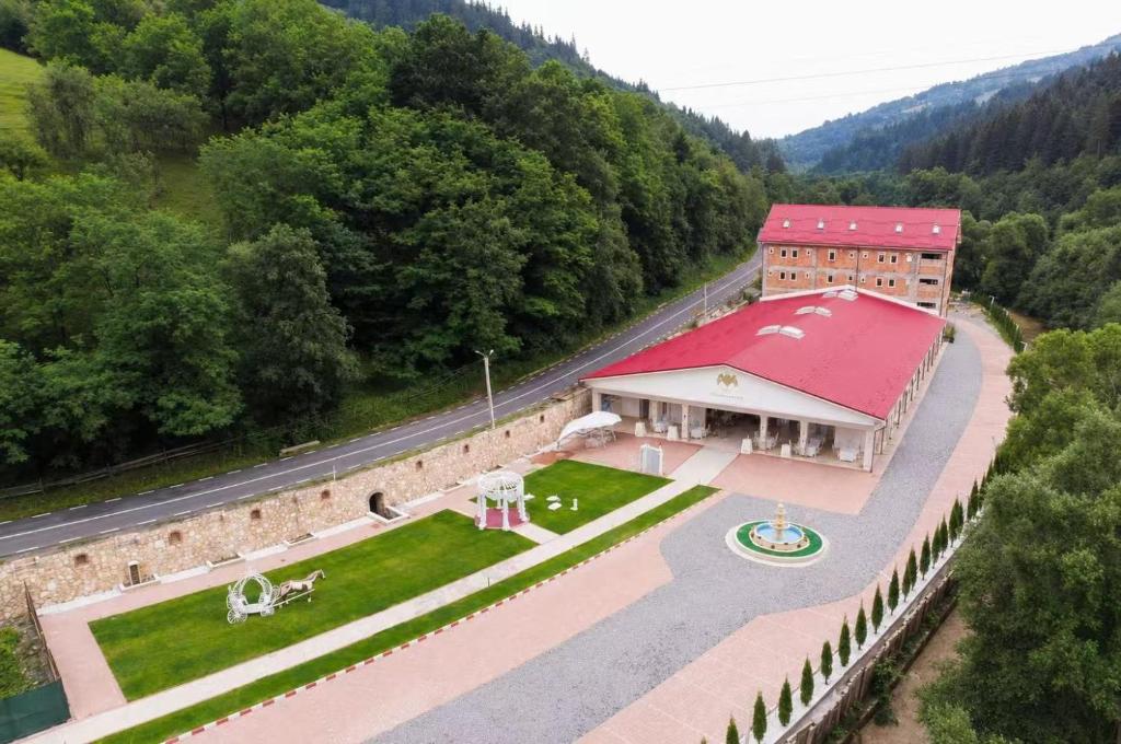an aerial view of a building with a red roof at Balea Events in Cîmpeni