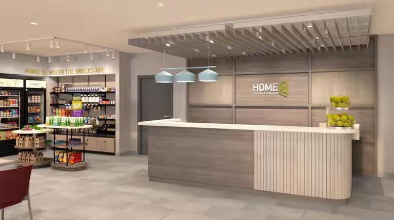 a store with a counter in the middle of a store at Home2 Suites By Hilton Hazleton in Hazleton