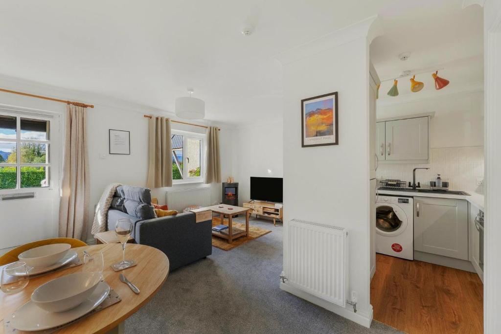 a living room with a dining table and a kitchen at 1 Bed in Windermere oc-lr189 in Windermere