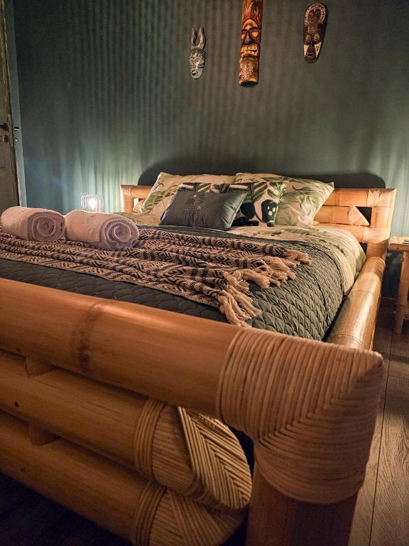 a bed made out of a log in a bedroom at Check in Silence in Tylicz