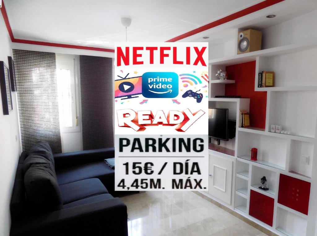 a living room with a sign that reads ready ready parking at La Farola Centro de Málaga con Parking 445 Max in Málaga