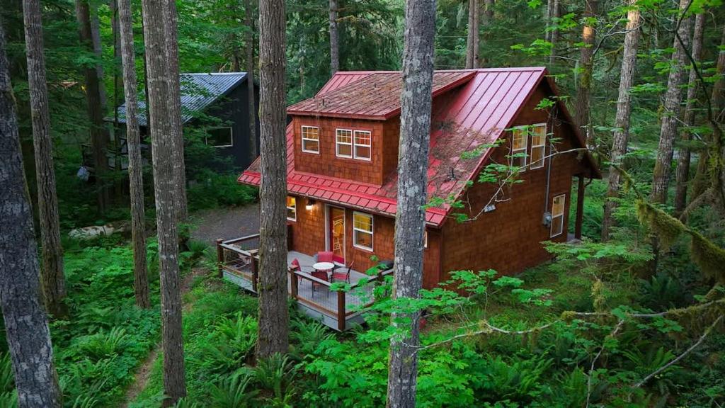 a tree house in the middle of the forest at Glacier Pines in Glacier