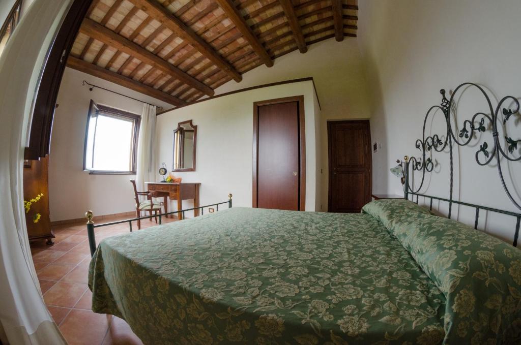 Łóżko lub łóżka w pokoju w obiekcie Villa le Vigne