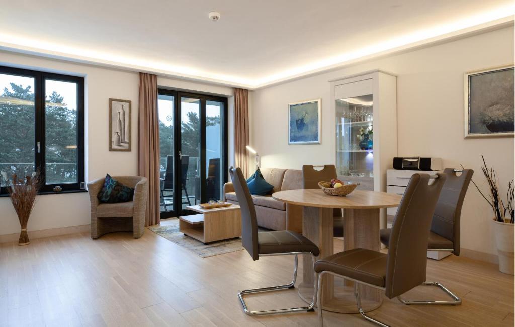 a living room with a table and chairs at Princess in Binz