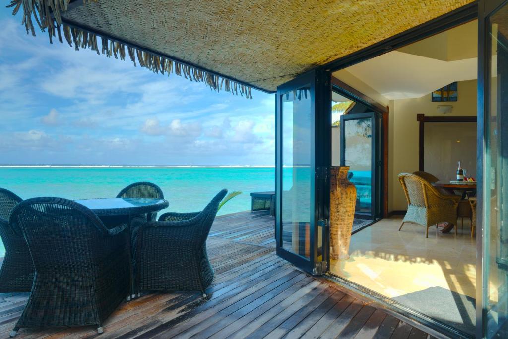 a view of the ocean from the deck of a villa at Reflections On Rarotonga in Rarotonga