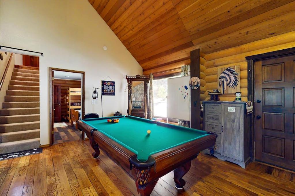 a pool table in a room with wooden ceilings at Sugar Pine Retreat in Twin Peaks