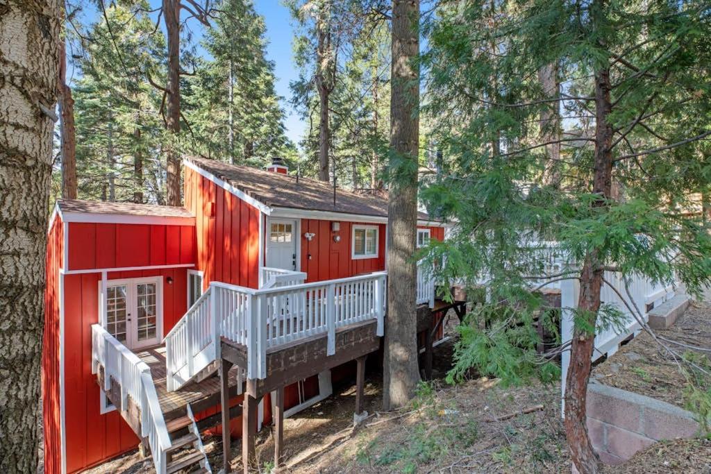 a red tiny house in the woods at Red Cottage Charmer in Lake Arrowhead